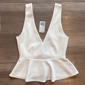 Deep V sleeveless peplum top